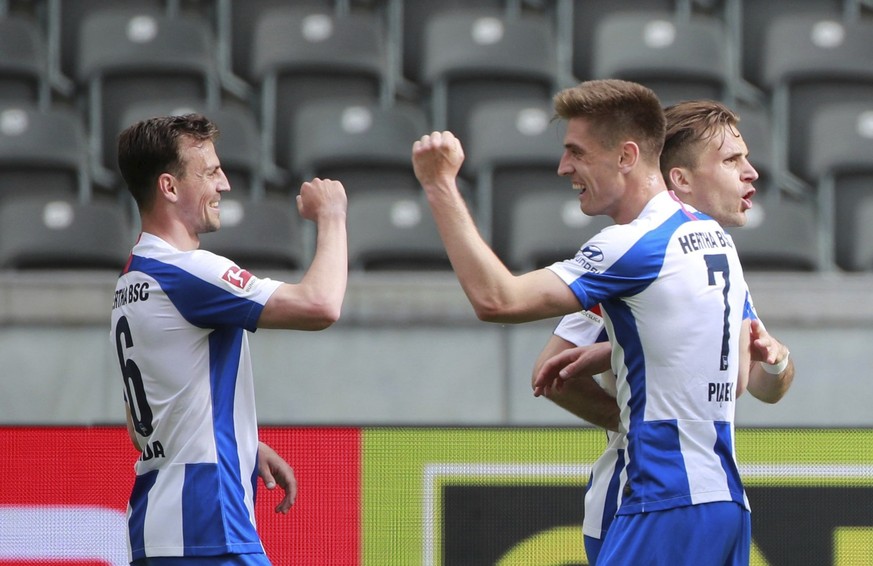 Herthas Krzysztof Piatek celebrates after his goal together with his team mate Vladimir Darida, left, during the German Bundesliga soccer match between Hertha Berlin and Augsburg at the Olympiastadion ...