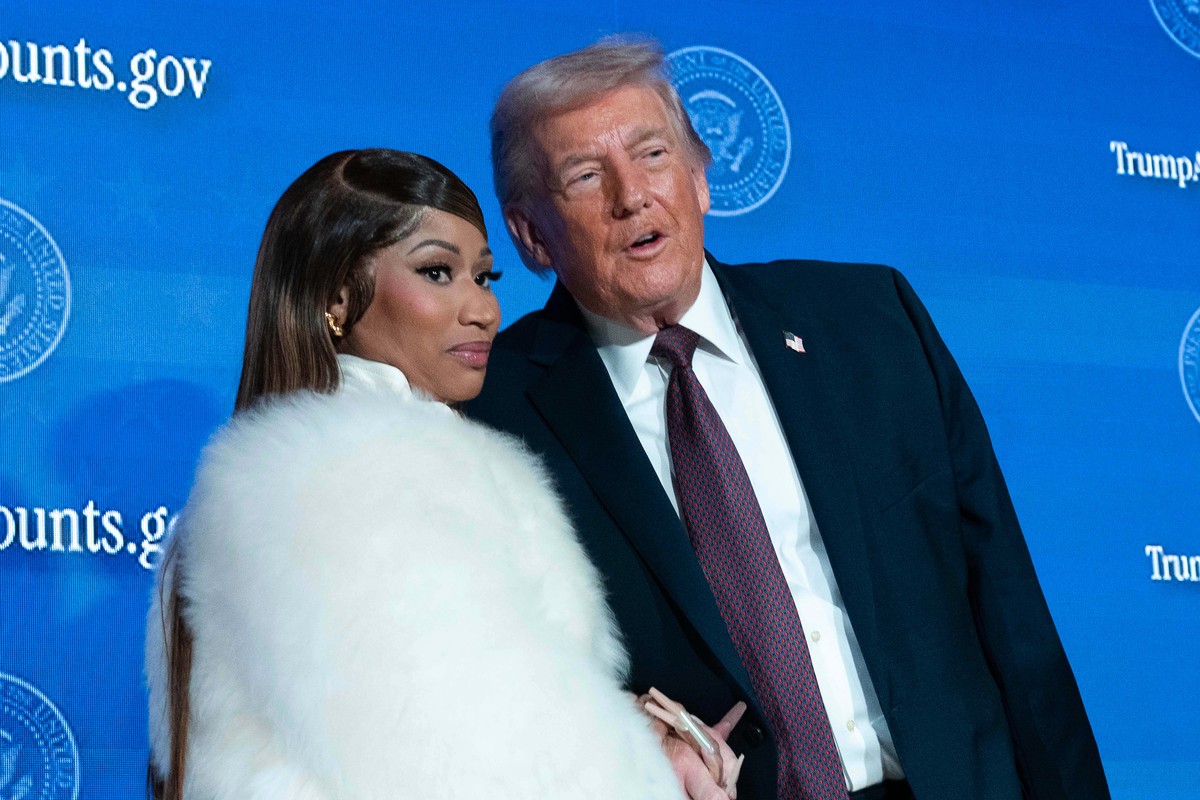 President Donald Trump talks with Nicki Minaj during the launch of a program known as Trump Accounts at the Andrew W. Mellon Auditorium, Wednesday, Jan. 28, 2026, in Washington. (AP Photo/Jose Luis Ma ...