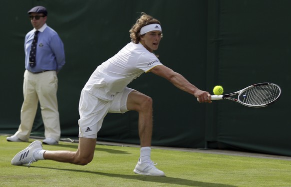 Germany&#039;s Alexander Zverev returns to Russia&#039;s Evgeny Donskoy during their Men&#039;s Singles Match on day two at the Wimbledon Tennis Championships in London Tuesday, July 4, 2017. (AP Phot ...