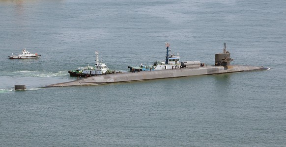 epa10705098 The USS Michigan, a nuclear-powered guided missile submarine, departs from a naval base in the southeastern port city of Busan, South Korea 22 June 2023, after conducting joint drills with ...