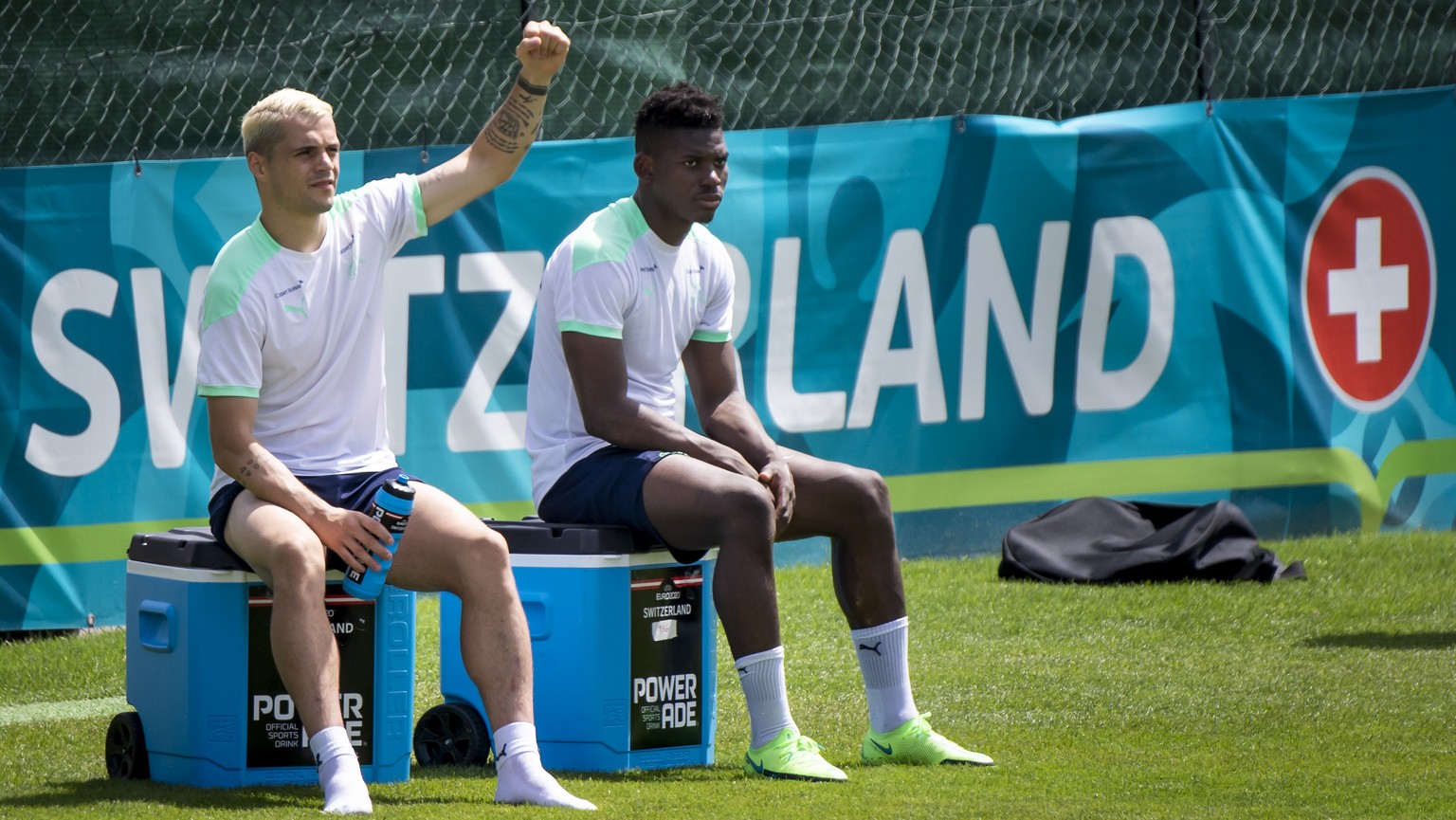 Switzerland&#039;s midfielder Granit Xhaka, left, and Switzerland&#039;s forward Breel Embolo, right, react during a training session for the Euro 2020 soccer tournament at the Tre Fontane sports cent ...