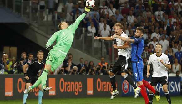 Football Soccer - Germany v France - EURO 2016 - Semi Final - Stade Velodrome, Marseille, France - 7/7/16
Germany&#039;s Manuel Neuer attempts to claim the ball ahead of France&#039;s Olivier Giroud  ...
