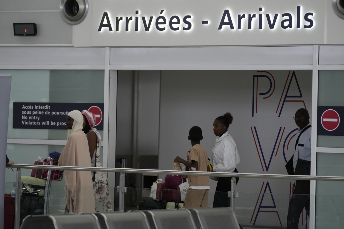 People arrive after being evacuated from Niger at the Roissy Charles de Gaulle airport, north of Paris, France, Wednesday, Aug. 2, 2023. European militaries are continuing to evacuate foreign national ...