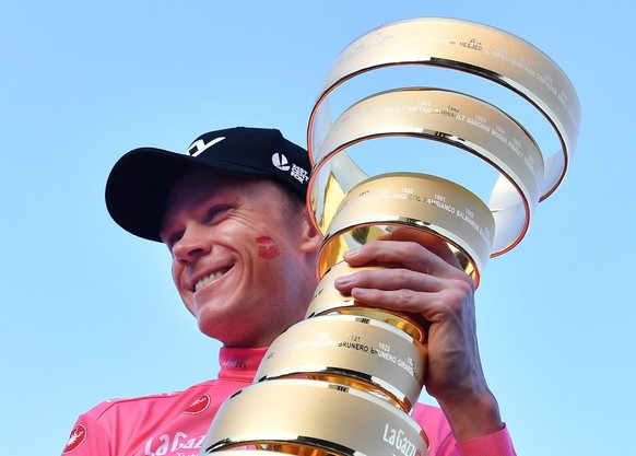 epa06767610 British rider Chris Froome of team Sky poses with the trophy of the Giro d&#039;Italia cycling race after the twenty-first and final stage of the Giro d&#039;Italia cycling race, over 115  ...
