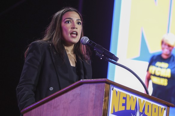 epa12486256 US Representative Alexandria Ocasio-Cortez (C) speaks during the &#039;New York Is Not For Sale&#039; rally at Forest Hills Stadium in the Queens borough of New York, New York, USA, 26 Oct ...