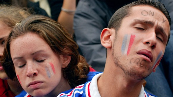 MAP04 - 20020611 - PARIS, FRANCE : French team supporters react 11 June 2002 in Paris after France was eliminated from the World Cup after losing 2-0 to Denmark. EPA PHOTO AFPI / PIERRE VERDY