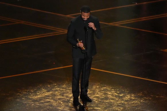 Michael B. Jordan accepts the award for actor in a leading role for "Sinners" during the Oscars on Sunday, March 15, 2026, at the Dolby Theatre in Los Angeles. (AP Photo/Chris Pizzello)
Mich ...