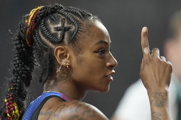 Sha&#039;Carri Richardson, of the United States, reacts after the women&#039;s 100 meters during the World Athletics Championships in Budapest, Hungary, Monday, Aug. 21, 2023. (AP Photo/Ashley Landis)