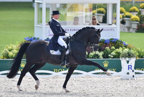 epa04882230 Matthias Alexander Rath of Germany rides his horse Totilas in the Grand Prix Dressage Team Final during the FEI European Championships in Aachen, Germany, 13 August 2015. EPA/UWE ANSPACH