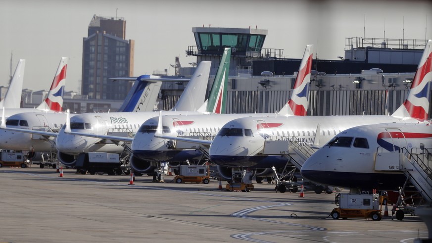 Airplanes are parked at London City Airport in London, Monday, Feb. 12, 2018. London City Airport is closed all day due to a WWII unexploded bomb. Cancellations are expected at London City Airport aft ...