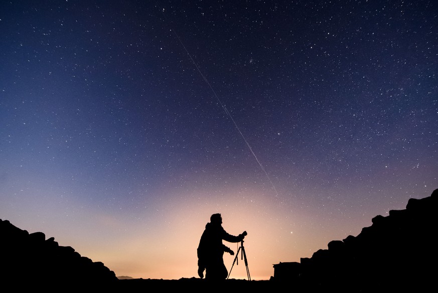 FILE - In this long exposure photo, Starlink satellites are visible in the sky near Salgotarjan, Hungary, early Monday, Nov. 25, 2019. (Peter Komka/MTI via AP, File)
China-Starlink
