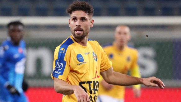 GENT, BELGIUM - DECEMBER 16: Milad Mohammadi of KAA Gent battles for the ball with Leonardo Bertone of Beveren during the Jupiler Pro League match day 18 between KAA Gent and Waasland-Beveren on Decem ...