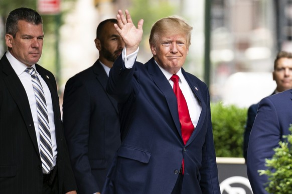 Former President Donald Trump waves as he departs Trump Tower, Wednesday, Aug. 10, 2022, in New York, on his way to the New York attorney general's office for a deposition in a civil investigation. (A ...