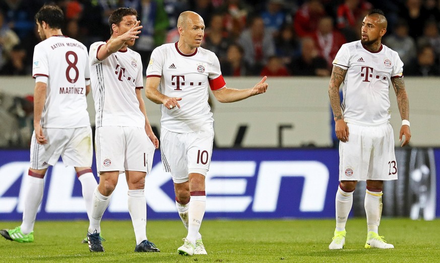 epa05888374 Bayern Munich players Xabi Alonso (2-L), Arjen Robben (C), and Arturo Vidal (R) react during the German Bundesliga soccer match between TSG 1899 Hoffenheim and FC Bayern Munich in Sinsheim ...