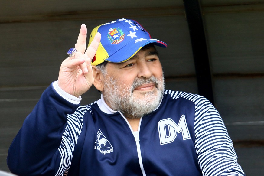 epa07986839 Gimnasia y Esgrima&#039;s head coach Diego Armando Maradona acknowledges fans during a game of his team against Aldosivi for the Argentine Superleague, at the Jose Maria Minella Stadium in ...