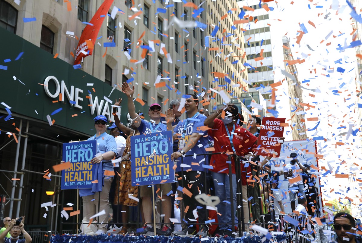 epa09329671 Health and Hospital workers ride up the Canyon of Heroes in lower manhattan at the Hometown Heroes Ticker Tape Parade in New York, New York, USA, 07 July 2021. Today's parade honors e ...