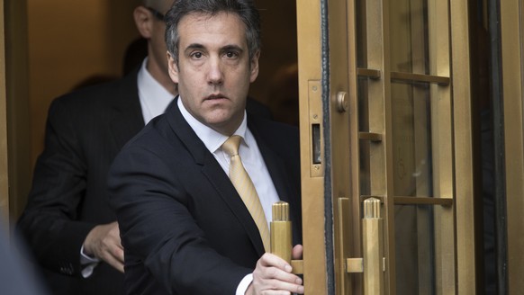 FILE - In this Aug. 21, 2018, file photo, Michael Cohen leaves Federal court, in New York. Cohen&#039;s lawyer, Lanny Davis, is walking back his assertions that the president&#039;s former &quot;fixer ...