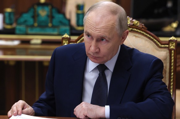 Russian President Vladimir Putin listens to Veronika Nikishina, the Director General of the Russian Export Center, JSC, during their meeting at the Kremlin in Moscow, Tuesday, July 7, 2026. (Gavriil G ...