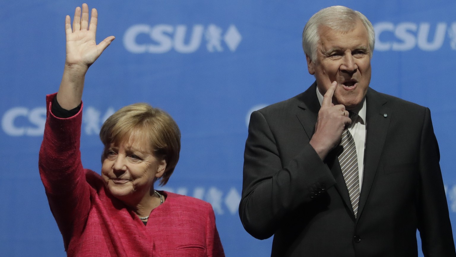 FILE - In this Sept. 22, 2017 file photo German Chancellor and Christian Democratic Union (CDU) party chairwoman Angela Merkel waves after her speech at an election campaign rally besides Bavarian sta ...