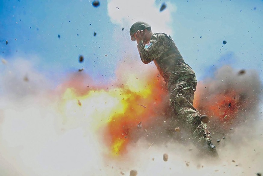 epa05940177 A handout photo made available on 02 May 2017 by the US Army and taken by US Army combat photographer Spc. Hilda I. Clayton showing an Afghan soldier as a mortar tube accidentally explodes ...