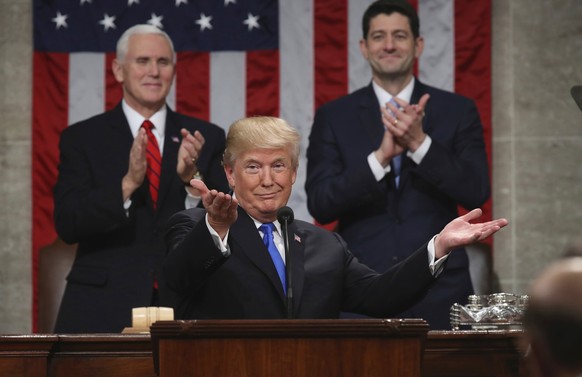 FILE - In this Jan. 30, 2018, file photo, President Donald Trump gestures as delivers his first State of the Union address in the House chamber of the U.S. Capitol to a joint session of Congress in Wa ...