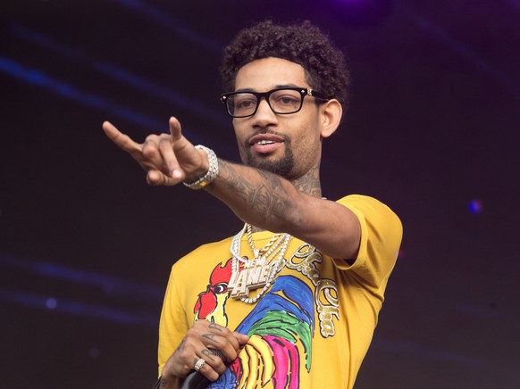 FILE - Philadelphia rapper PnB Rock performs at the 2018 Firefly Music Festival in Dover, Del., on June 16, 2018. The rapper, whose real name is Rakim Allen, was fatally shot during a robbery in South ...