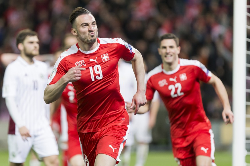 Swiss forward Josip Drmic, right, celebrates his goal after scored the 1:0 during the 2018 Fifa World Cup Russia group B qualification soccer match between Switzerland and Latvia, at the stade de Gene ...