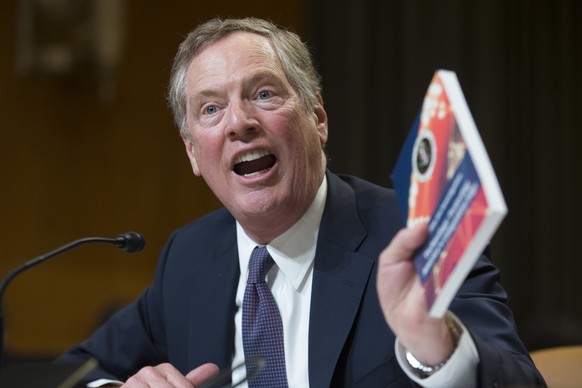 epa06912159 US Trade Representative Robert Lighthizer holds up a copy of a report entitled &#039;Technology - Protecting American&#039;s Competitive Edge&#039;, while testifying on trade policy with C ...