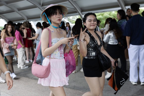epa11193140 Fans of US singer Taylor Swift, known as Swifties, arrive to attend the first day of her concert at the National Stadium in Singapore, 02 March 2024. The US super star will be performing a ...