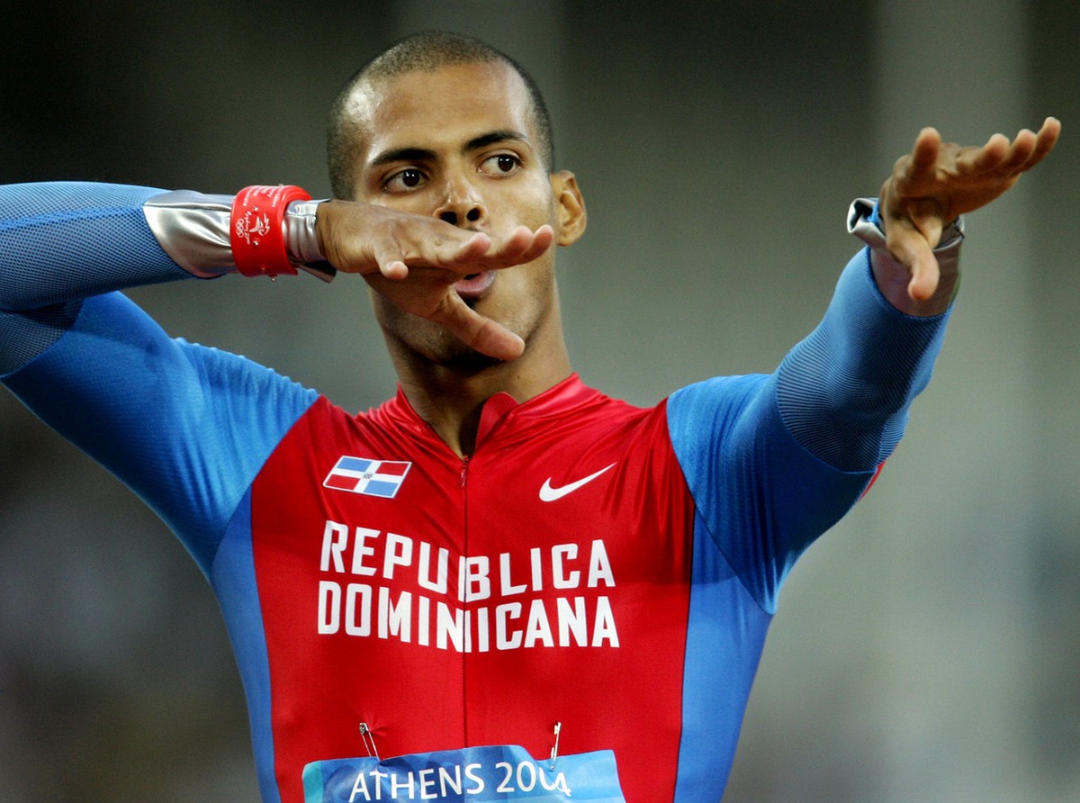 Felix Sanchez, of the Dominican Republic, gestures after running in a qualification heat of the 400-meter hurdles at the Olympic Stadium during the 2004 Olympic Games in Athens, Monday, Aug. 23 2004.  ...