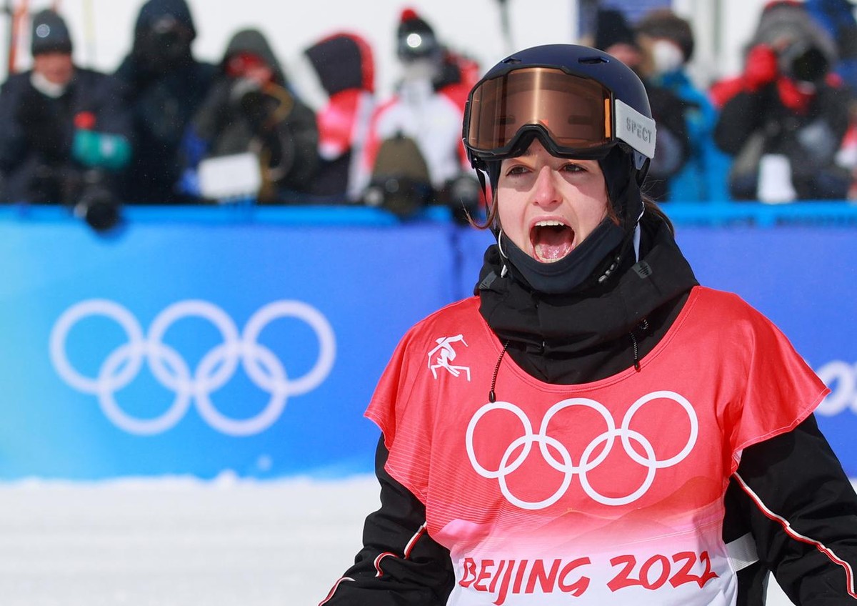 epa09757306 Gold medalist Mathilde Gremaud of Switzerland celebrates during Women's Freestyle Skiing Slopestyle final at the Zhangjiakou Genting Snow Park at the Beijing 2022 Olympic Games, Beiji ...