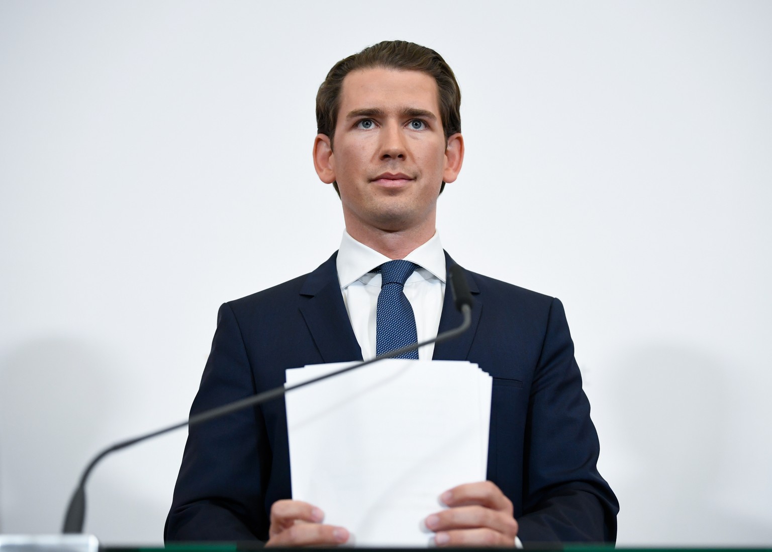 epa07582303 Austrian Chancellor Sebastian Kurz holds his speech manuscript after announcing new elections in Austria on a statement in Vienna, Austria, 18 May 2019. Austrian Vice Chancellor Strache on ...