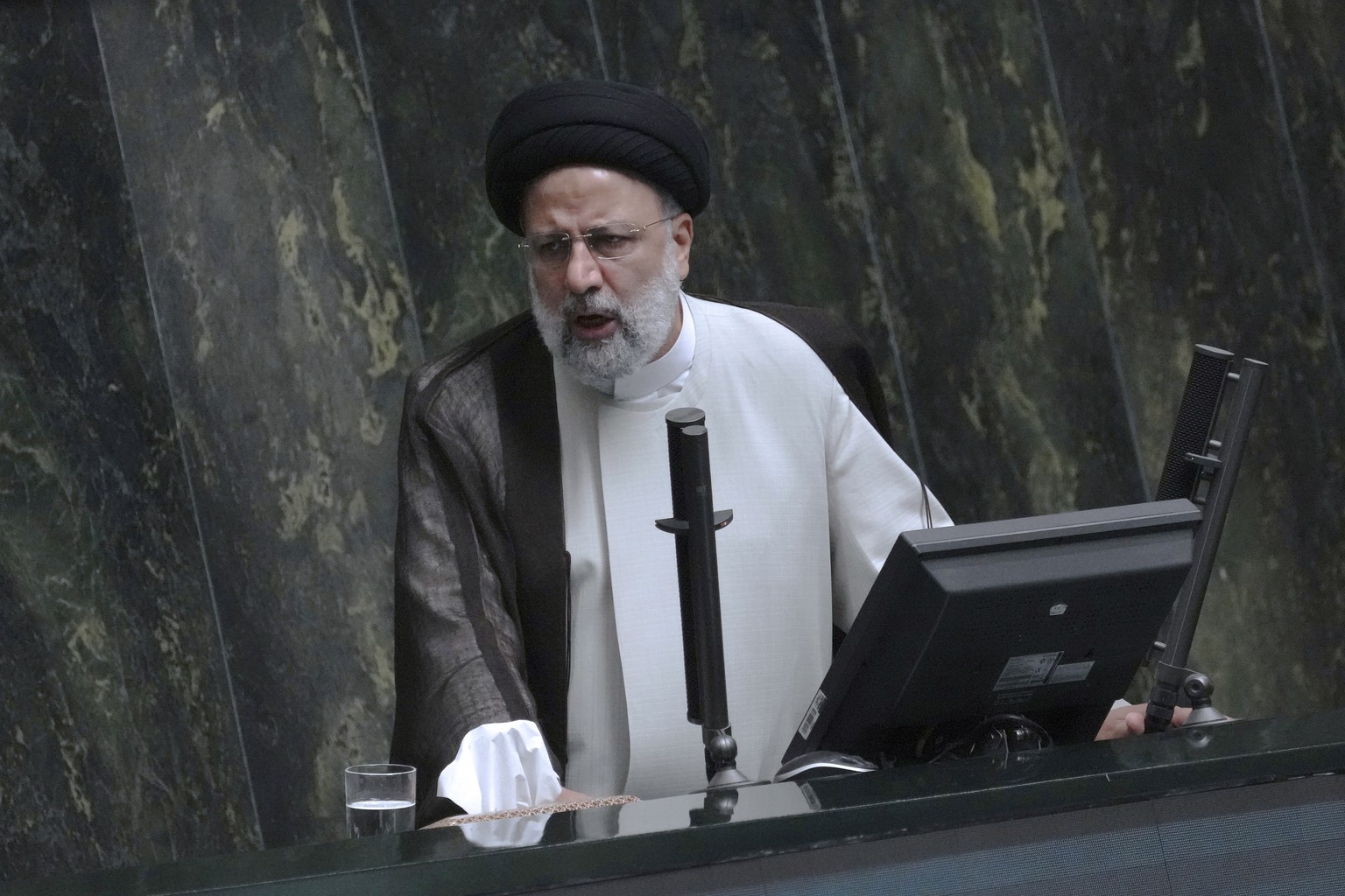 Iranian President Ebrahim Raisi addresses the parliament in a vote of confidence session for his proposed labor minister in Tehran, Iran, Tuesday, Oct. 4, 2022. (AP Photo/Vahid Salemi)
Ebrahim Raisi