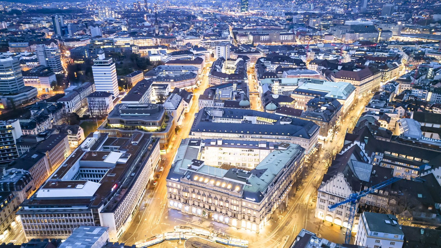 epa10532657 An aerial view shows the headquarters of the Swiss banks Credit Suisse (R) and UBS (L), at Paradeplatz in Zurich, Switzerland, 19 March 2023. The bank UBS takes over Credit Suisse for 2 bi ...