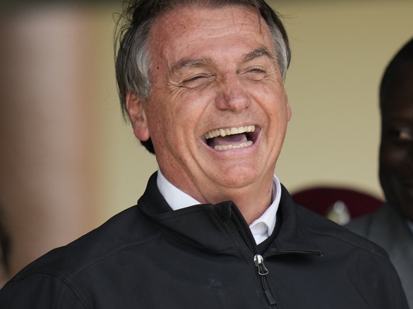 Brazil&#039;s President Jair Bolsonaro laughs out loud during a graduation ceremony of the 76th Anniversary of the Parachute Infantry Brigade, at a military base in Rio de Janeiro, Brazil, Friday, Nov ...