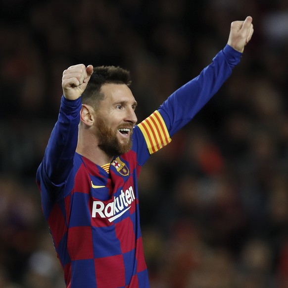Barcelona's Lionel Messi celebrates after his team scored his side's fourth goal during a Spanish La Liga soccer match between Barcelona and Celta at Camp Nou stadium in Barcelona, Saturday, ...