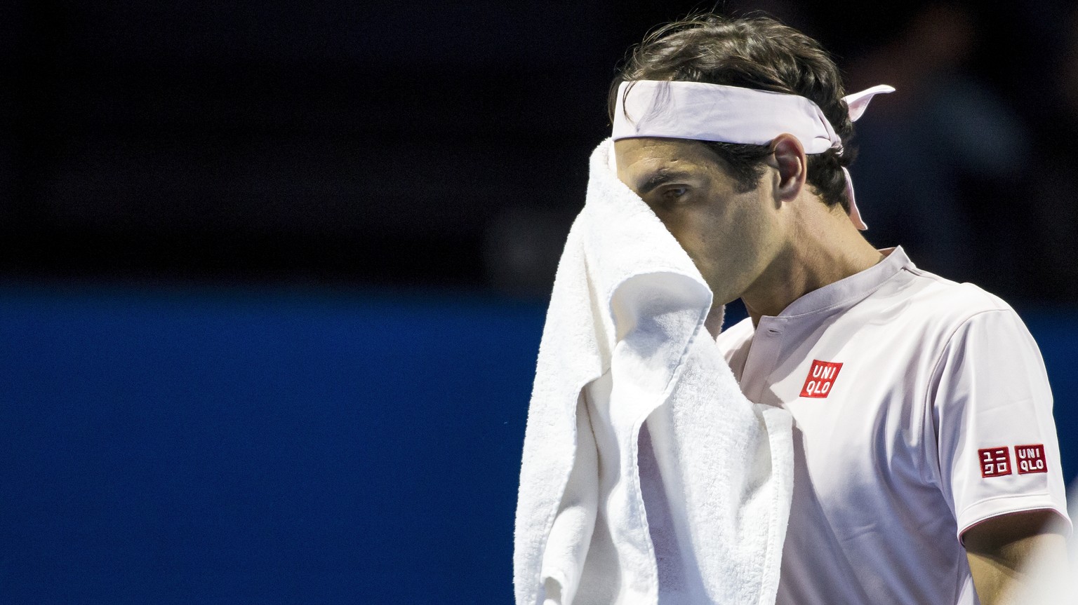 Roger Federer of Switzerland reacts during the quarter-final match against Gilles Simon of France at the Swiss Indoors tennis tournament at the St. Jakobshalle in Basel, Switzerland, on Friday, Octobe ...