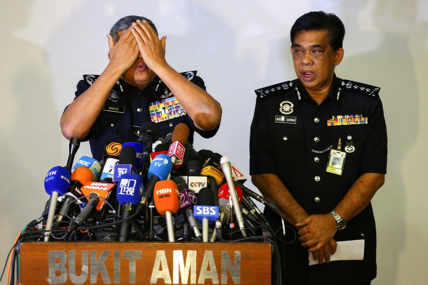 Malaysia&#039;s Royal Police Chief Khalid Abu Bakar demonstrates to the media during a news conference regarding the apparent assassination of Kim Jong Nam, the half-brother of the North Korean leader ...