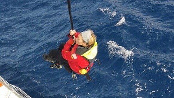 epa07215335 A handout photo made available by the Chilean Navy shows English yachtswoman Susie Goodall as she is rescued by a cargo ship at sea, west of Cape Horn, Chile, 07 December 2018. Susie Gooda ...