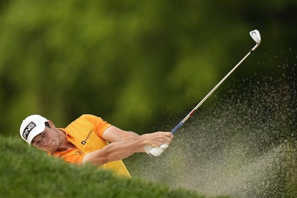 FILE - Viktor Hovland, of Norway, fails to get his ball out of the bunker on the 16th hole during the final round of the PGA Championship golf tournament at Oak Hill Country Club on Sunday, May 21, 20 ...
