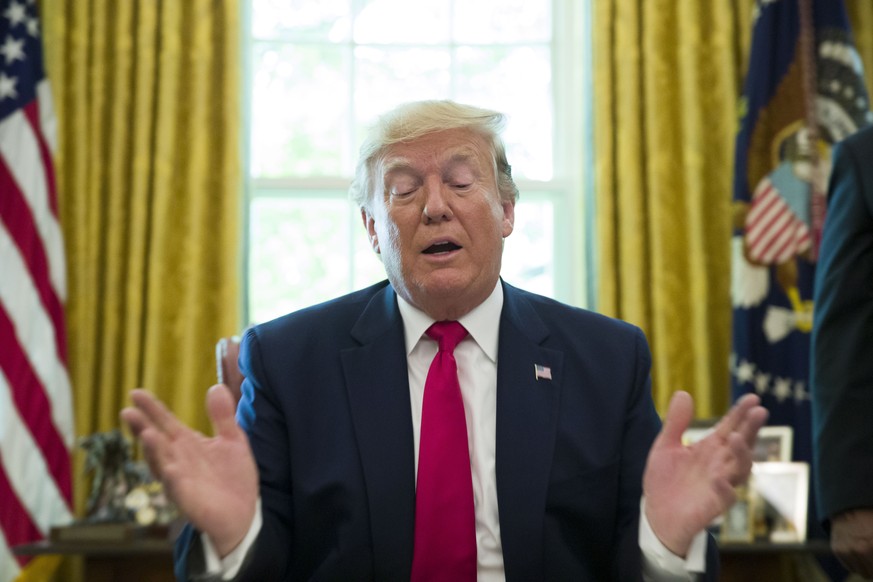 President Donald Trump speaks after signing an executive order to increase sanctions on Iran, in the Oval Office of the White House, Monday, June 24, 2019, in Washington. Trump is accompanied by Treas ...