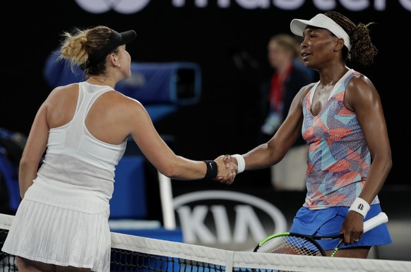 Switzerland&#039;s Belinda Bencic, left, is celebrated by United States&#039; Venus Williams after Bencic won their first round match at the Australian Open tennis championships in Melbourne, Australi ...