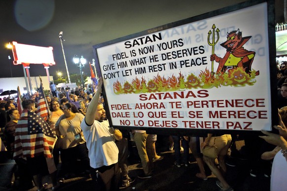 epa05648021 Members of the Cuban community and residents of Miami celebrate the death of former Cuban President Fidel Castro at the popular Cuban restaurant Versailles in Little Havana neighborhood of ...