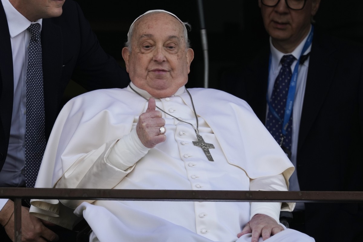 Pope Francis thumbs up as he appears at a window of the Agostino Gemelli Polyclinic in Rome, Sunday, March 23, 2025, where he has been treated for bronchitis and bilateral pneumonia since Feb. 14. (AP ...