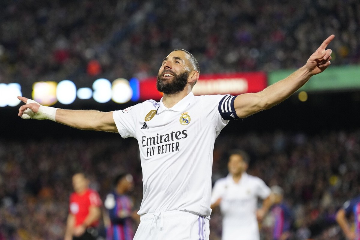 epa10560634 Real Madrid's striker Karim Benzema celebrates after scoring the 0-4 goal during the Spanish King's Cup semifinal second leg soccer match between FC Barcelona and Real Madrid, in ...