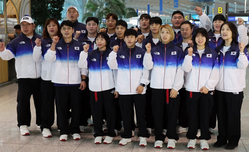 epa11484820 South Korean national judoists pose at Incheon International Airport, in Incheon, South Korea, 18 July 2024, before their departure for Paris ahead of the upcoming Olympic Games. EPA/YONHA ...