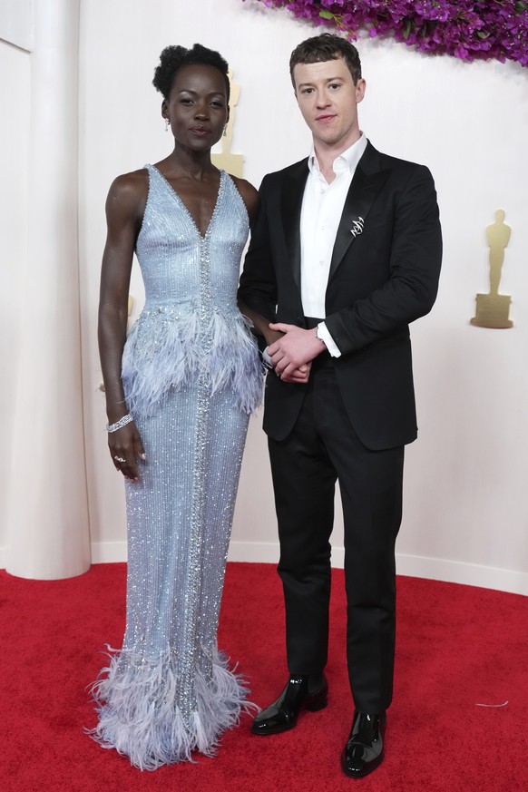 Lupita Nyong&#039;o, left, and Joseph Quinn arrive at the Oscars on Sunday, March 10, 2024, at the Dolby Theatre in Los Angeles. (Photo by Jordan Strauss/Invision/AP)
Lupita Nyong&#039;o,Joseph Quinn
