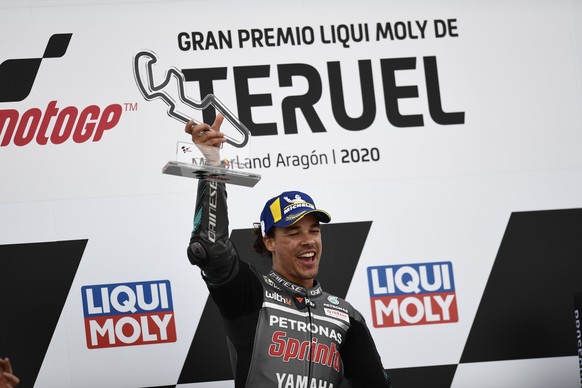 Italian rider Franco Morbidelli of the Petronas Yamaha SRT celebrates on the podium after wining the Motorcycle Grand Prix of Teruel in Alcaniz, Spain, Sunday, Oct. 25, 2020. (AP Photo/Jose Breton)