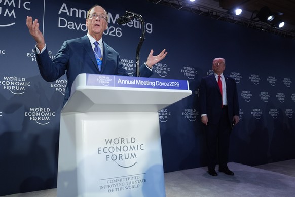 Blackrock CEO Larry Fink, introduces President Donald Trump during a meeting of Global Business Leaders at the Annual Meeting of the World Economic Forum in Davos, Switzerland, Wednesday, Jan. 21, 202 ...