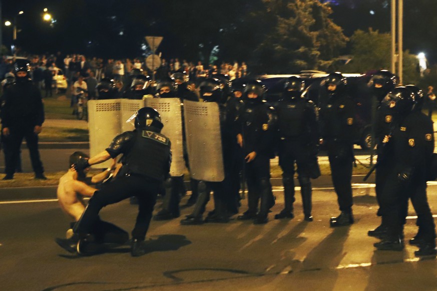 Belarus&#039; riot police detain a protester after the Belarusian presidential election in Minsk, Belarus, Sunday, Aug. 9, 2020. Police and protesters clashed in Belarus&#039; capital and the major ci ...